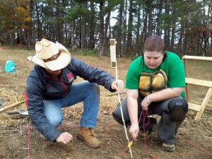 Cowboy Zach and Ninja Turtle Jessica take opening measurements.